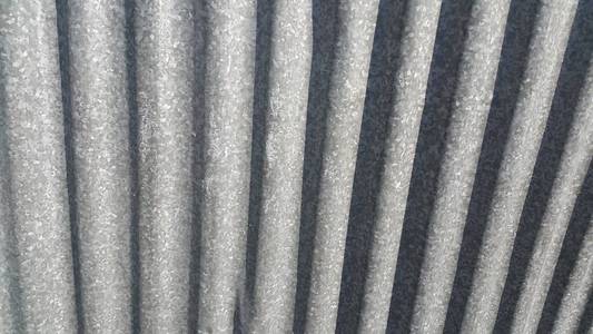 Silver corrugated metal sheet texture background 