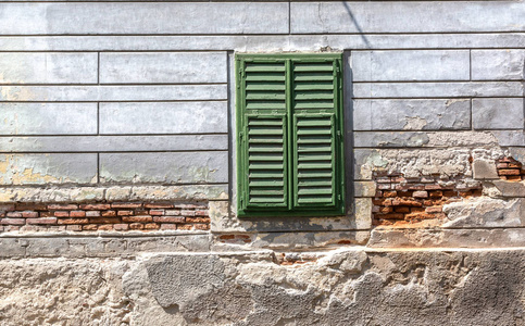 Old window with wooden shutters 