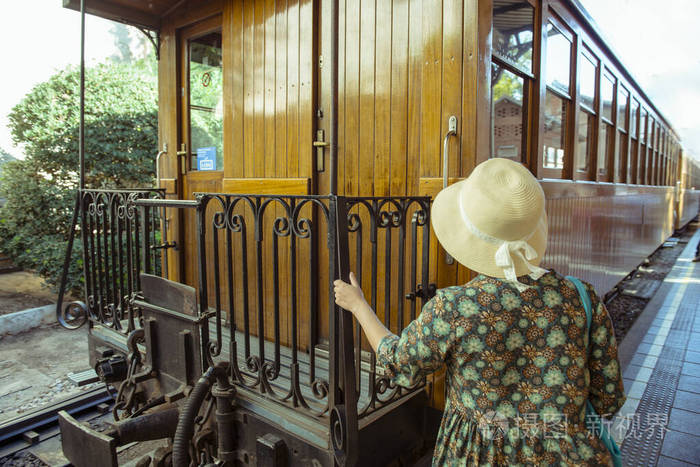 Back in time  Traveling. Rear view of beautifull woman in long 