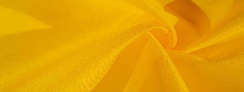 纹理背景图案，黄色丝绸。绉缎