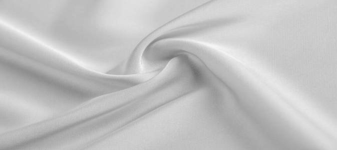 background texture, pattern. White silk fabric. It has a smooth 