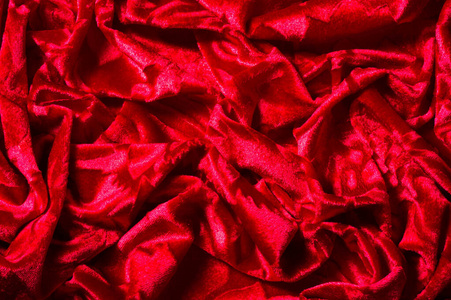 天鹅绒布料丝绒,红色的布料.这华丽的弹性天鹅绒面料照片