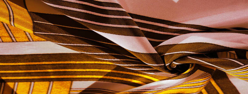 Texture, background, silk fabric with a yellow striped pattern. 