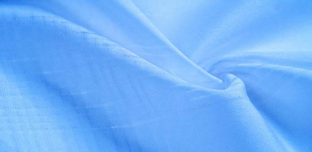 纹理背景，图案。蓝色丝绸面料。从Telio，这个