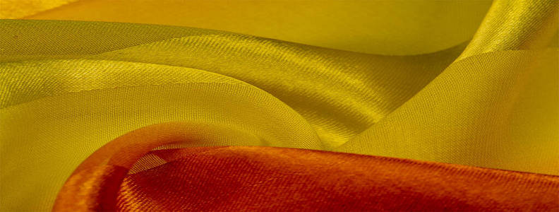 Texture, background, yellow silk striped fabric with a metallic 