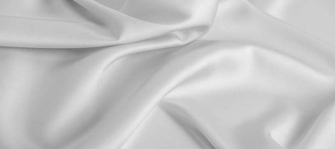 background texture, pattern. White silk fabric. It has a smooth 