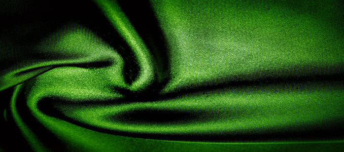 纹理，背景，图案。绿色丝织物全景照片。