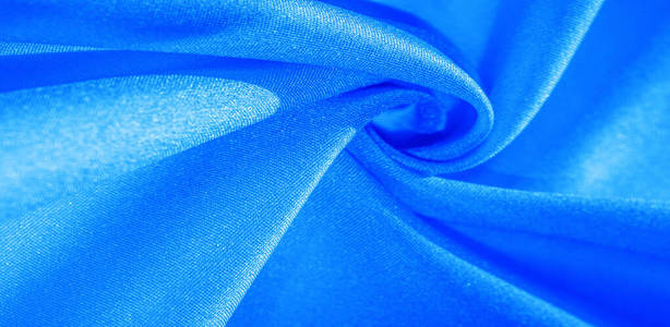 Texture, background, pattern, silk fabric in blue. This silk is 