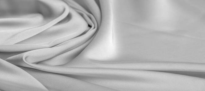 background texture, pattern. White silk fabric. It has a smooth 