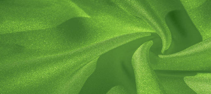 Texture, background, pattern, silk green fabric. Crepe satin on 