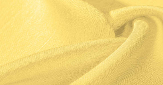 Background, pattern, texture, wallpaper, yellow silk fabric. It 