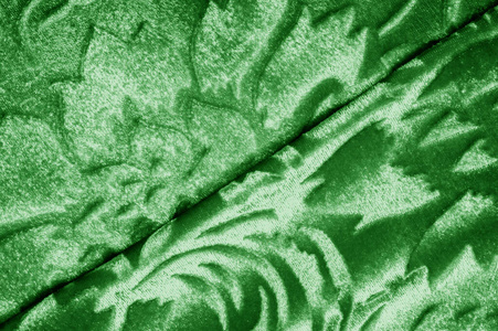 丝绒绿色织物天鹅绒图案从一个未受割礼的人下面雕刻而成照片