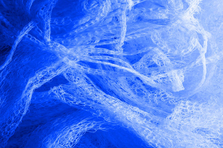 Texture background, pattern. blue fabric in a mesh, a beautiful 