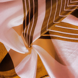 Texture, background, silk fabric with a yellow striped pattern. 