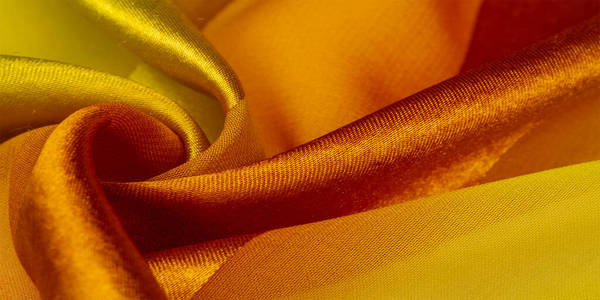 Texture, background, yellow silk striped fabric with a metallic 