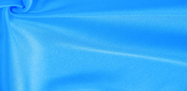 Texture, background, pattern, silk fabric in blue. This silk is 