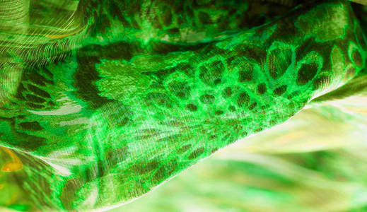 背景纹理，图案。绿色翡翠色的丝绸。