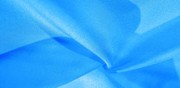 Texture, background, pattern, silk fabric in blue. This silk is 