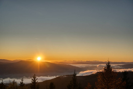 sunrise over mountains with fog in valley , javorovy vrch , czec