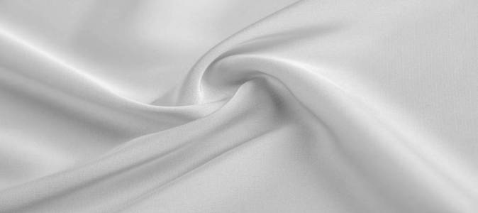 background texture, pattern. White silk fabric. It has a smooth 