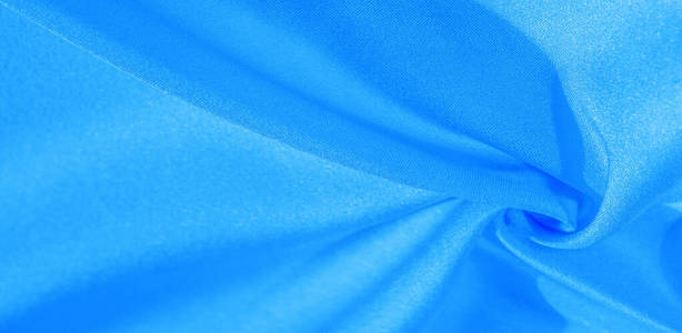 Texture, background, pattern, silk fabric in blue. This silk is 