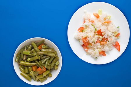  rice with vegetables on a white plate top view, white rice with