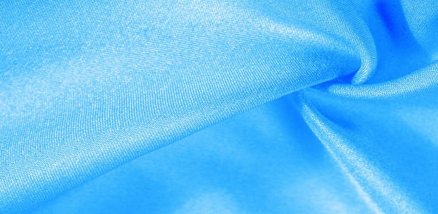 Texture, background, pattern, silk fabric in blue. This silk is 