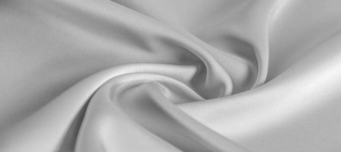 background texture, pattern. White silk fabric. It has a smooth 