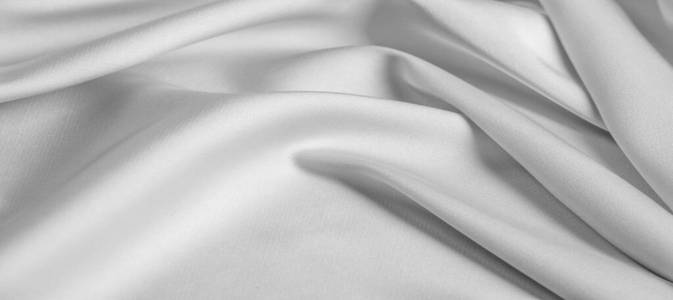 background texture, pattern. White silk fabric. It has a smooth 