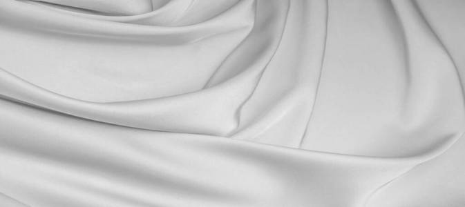 background texture, pattern. White silk fabric. It has a smooth 