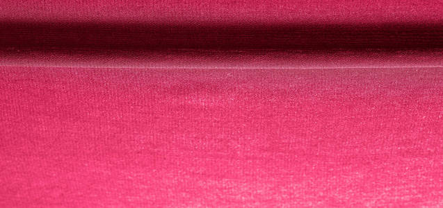 Background texture of silk fabric. This is a natural red scarf, 