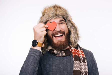 Handsome bearded guy fell in love, wearing winter warm and cozy 