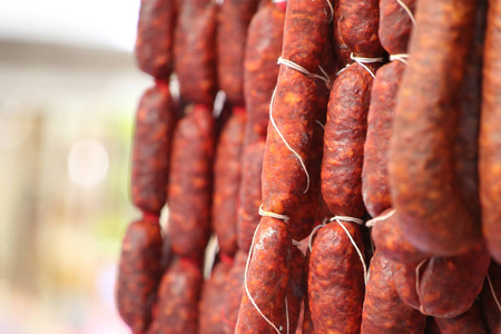 Close up of Chorizo sausages hanging up with string, speciality 