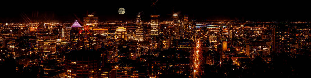 蒙特利尔市中心美丽的夜空天际线全景。美格