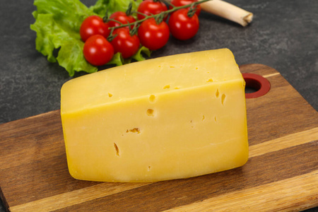 Hard yellow tasty cheese brick 