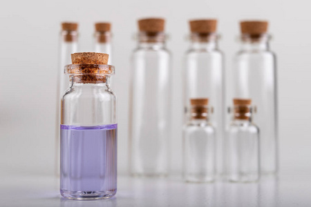 Blue liquid in a glass vial. Accessories in the laboratory. 