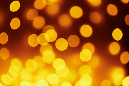 Background of golden lights in a bokeh. Defocused abstract blurr