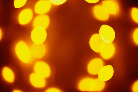 Background of golden lights in a bokeh. Defocused abstract blurr