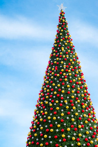 christmas tree with decorates balls and large beautiful star at 