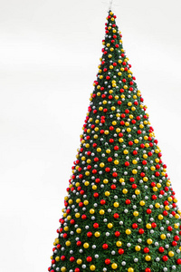 christmas tree with decorates balls and large beautiful star at 