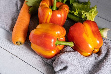 fresh vegetables on a light background. orange carrot, twotone 