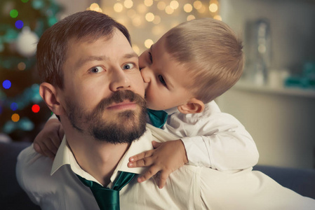 Father with his little son in Christmas decorated interior with 