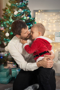 Father with his little son in Christmas decorated interior with 