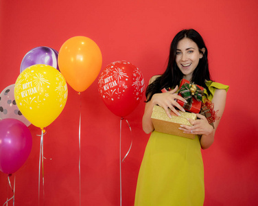 A Young Caucasian lady feel happy with her New years gifts from 