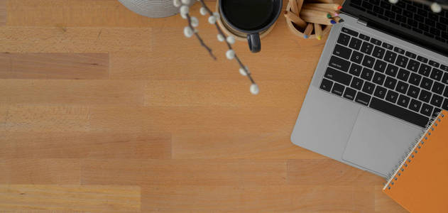 Top view of modern workspace with laptop computer and  sup