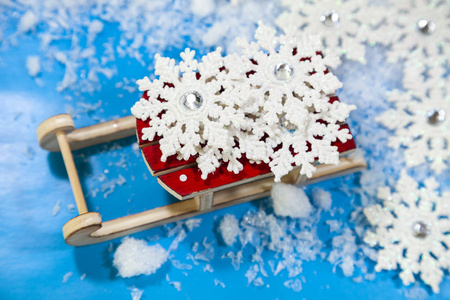 Wooden sleigh and snow 