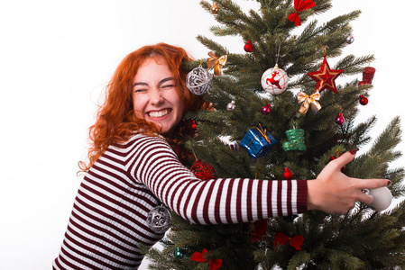 Close up photo of cheerful woman with ginger hair hug christmas 