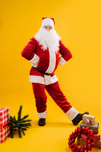 Cheerful Santa Claus in a funny pose, studio shot. 