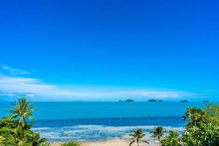 Beautiful tropical sea ocean with coconut palm tree on blue sky 