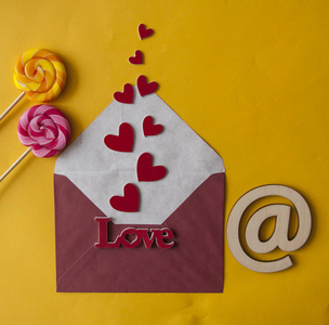 Word Love in envelope with red hearts for Valentines Day, 